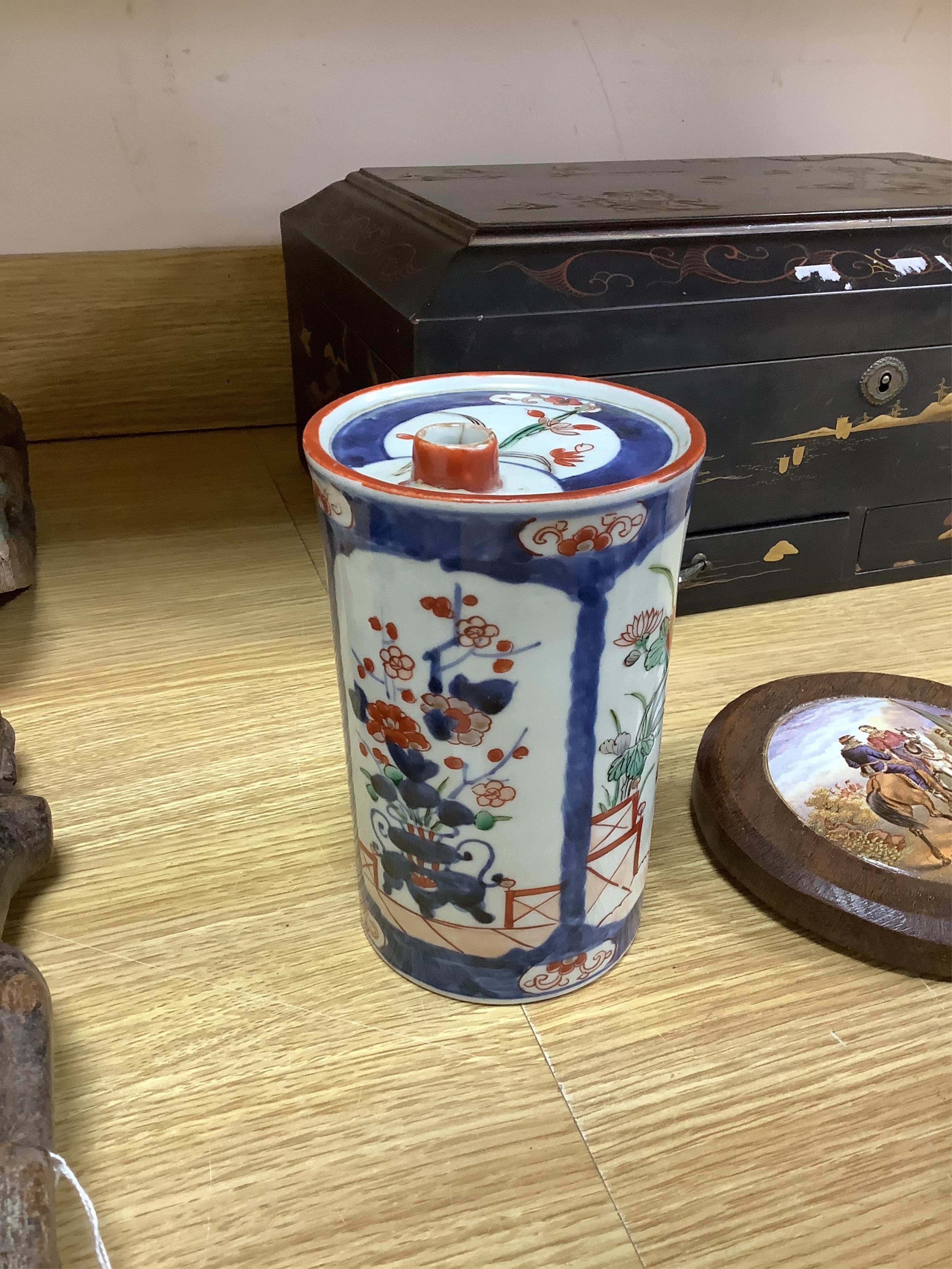 A collection of Chinese ceramics to include a blue and white mug, set of three graduated Canton jars and covers and two cylindrical brush washers